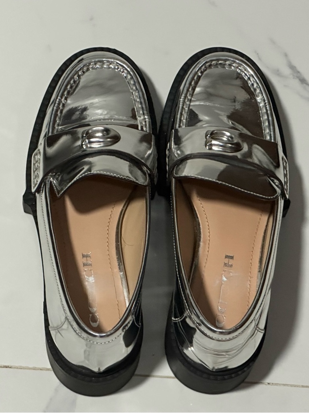 Coach Metallic Silver Women’s Penny Loafers, size 6.